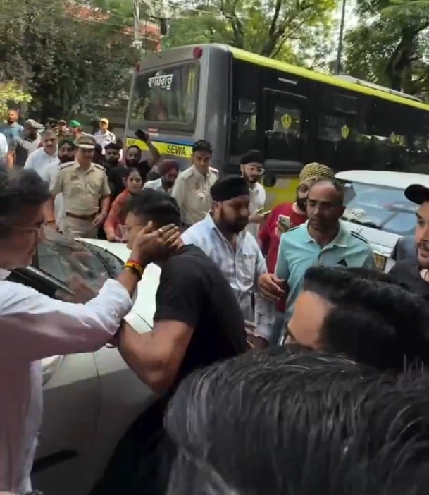 Delhi Minister Parvesh Verma seen slapping an AAP MLAs assistant during a road inspection in Tilak Nagar Delhi Minister Parvesh Verma seen slapping an AAP MLAs assistant during a road inspection in Tilak Nagar