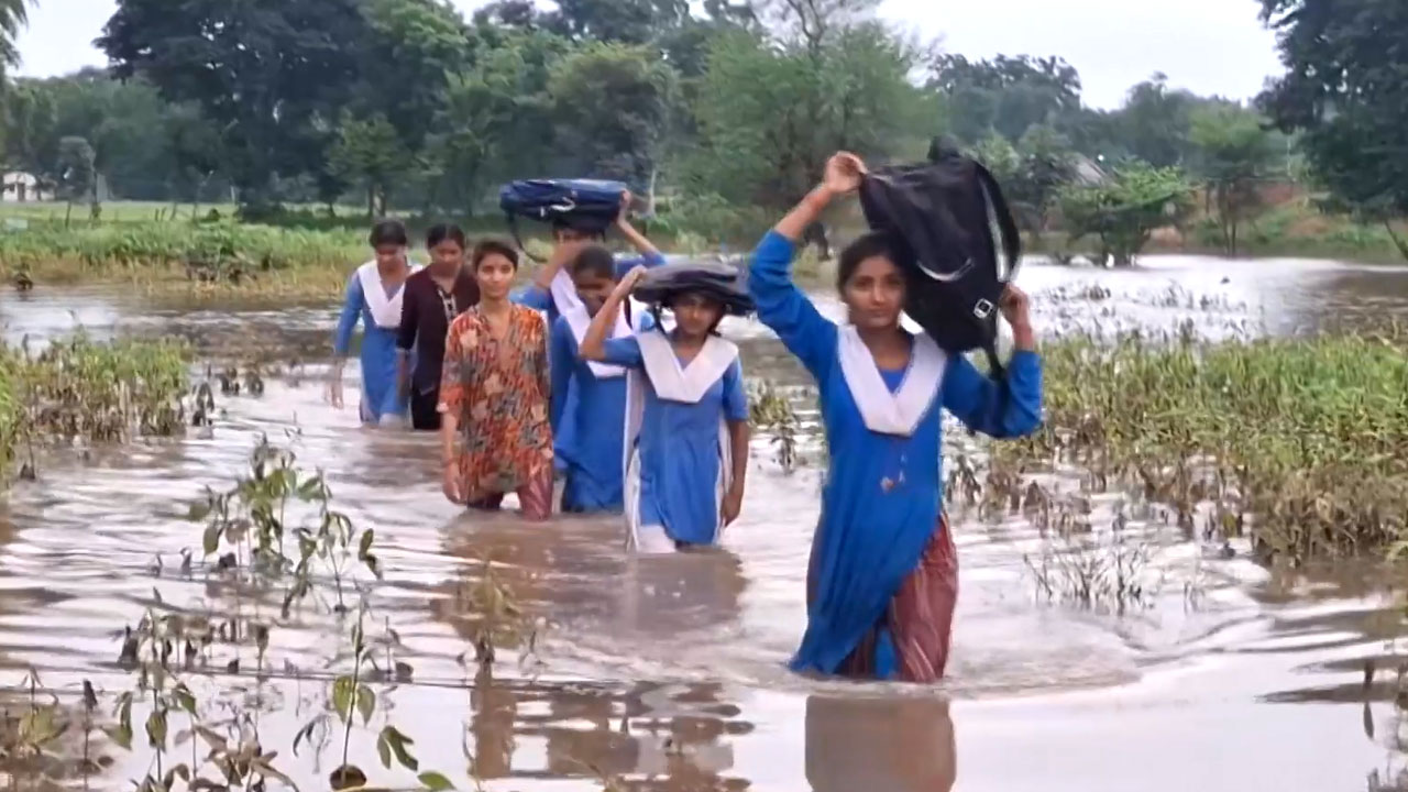 Schoolchildren Wade Through Floodwaters To Reach School In Madhya Pradesh's Chhatarpur