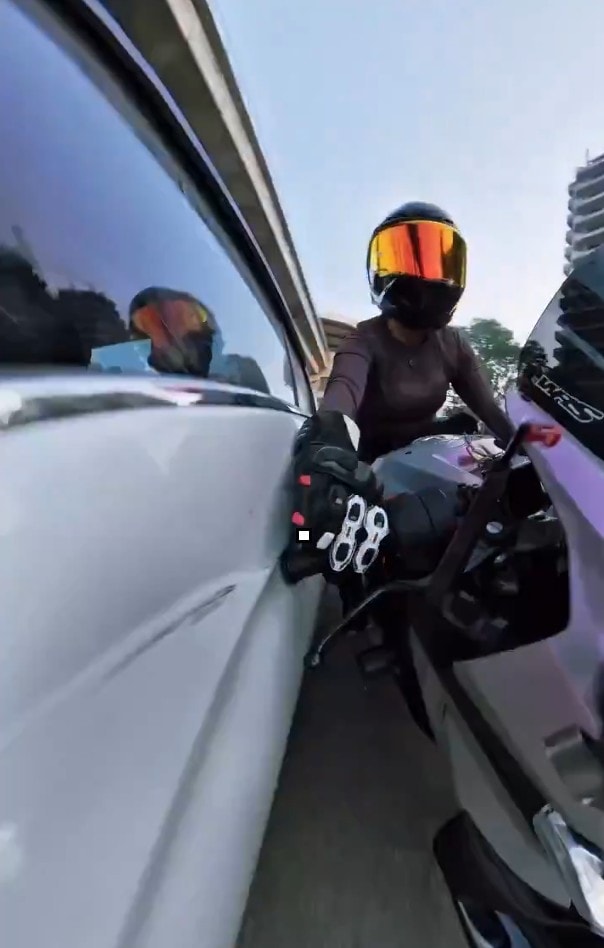 A white sedan rams Sia while she was riding her superbike in Gurugram on Sunday A white sedan rams Sia while she was riding her superbike in Gurugram on Sunday