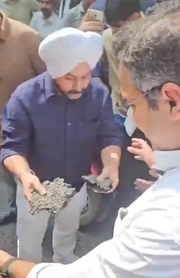 AAP MLA Jarnail Singh seen with huge chunks of road in his hand AAP MLA Jarnail Singh seen with huge chunks of road in his hand