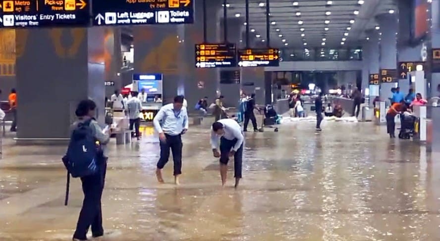 Airport staff inspect the waterlogging condition at Indira Gandhi International Airport Airport staff inspect the waterlogging condition at Indira Gandhi International Airport