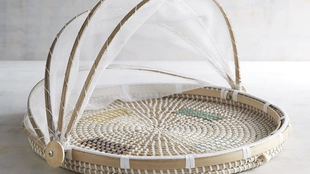 A neat fruit basket on a kitchen counter keeps fruit fresh, dust-free, and easy to reach