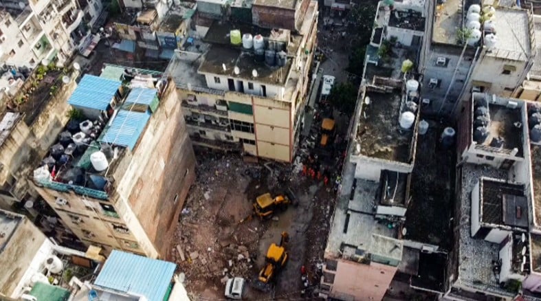 An aerial view showing search and rescue operations in Delhis Satya Niketan area following building collapse