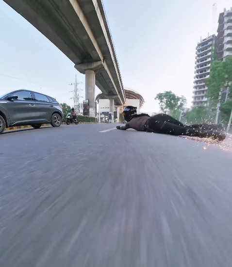 Sia seen crashing after the sedan rammed her superbike