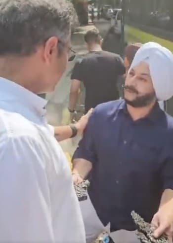 AAP MLA Jarnail Singh shows off hugs chunks of road he had peeled off right in front of Parvesh Verma AAP MLA Jarnail Singh shows off hugs chunks of road he had peeled off right in front of Parvesh Verma