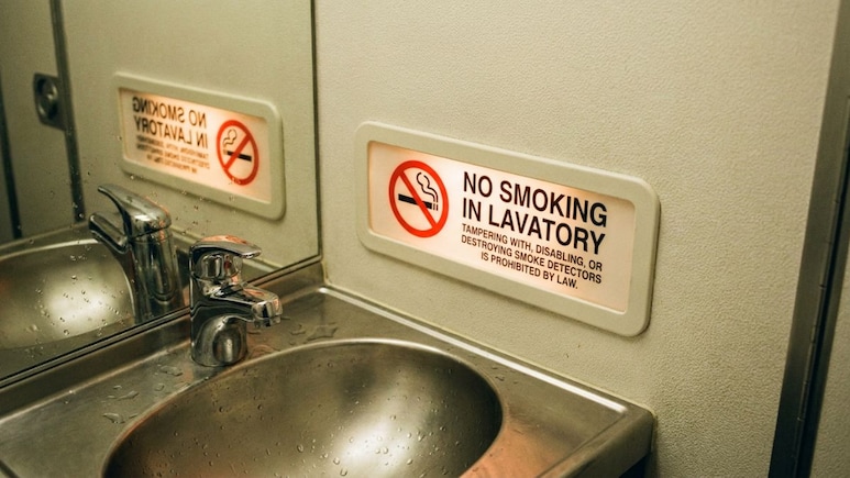 Why Do Airplanes Still Have Ashtrays When Smoking Is Banned?