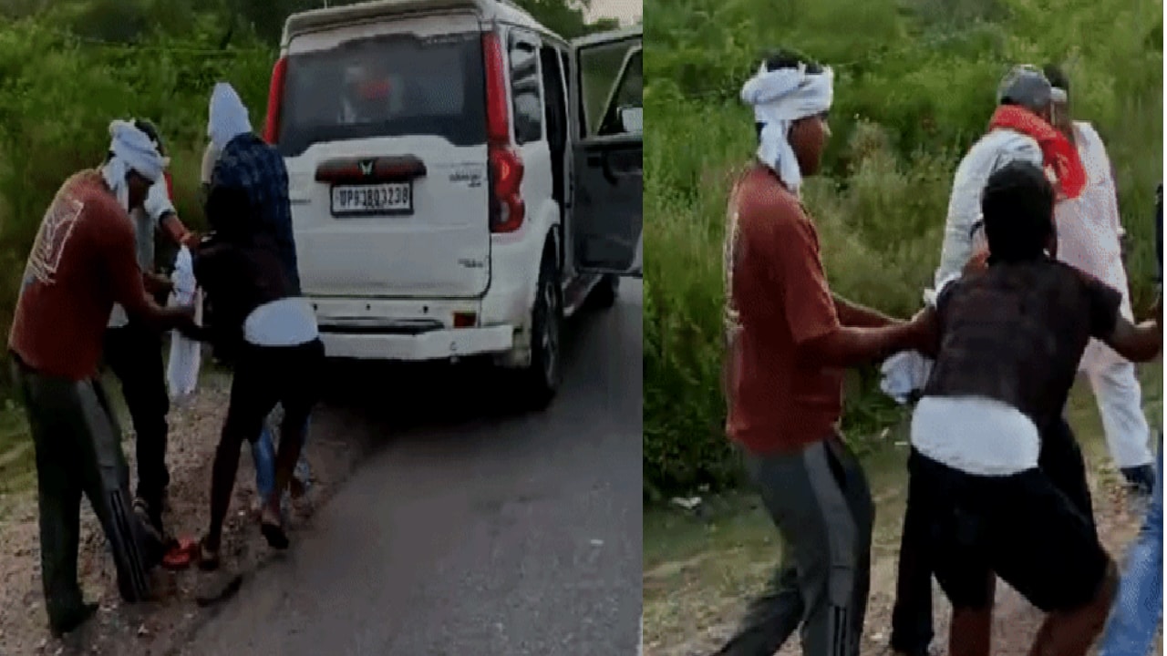 युवक को घसीटकर गाड़ी की ओर ले जाते हुए युवक को घसीटकर गाड़ी की ओर ले जाते हुए