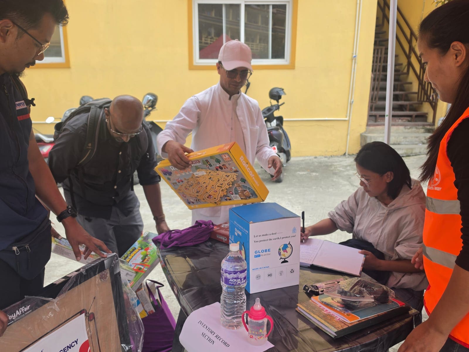 Man donating board games for children. Man donating board games for children.