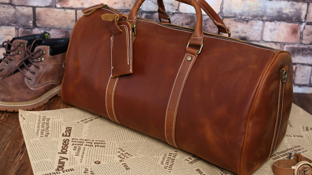 A neatly packed weekender bag by the door, ready for a quick getaway A neatly packed weekender bag by the door, ready for a quick getaway