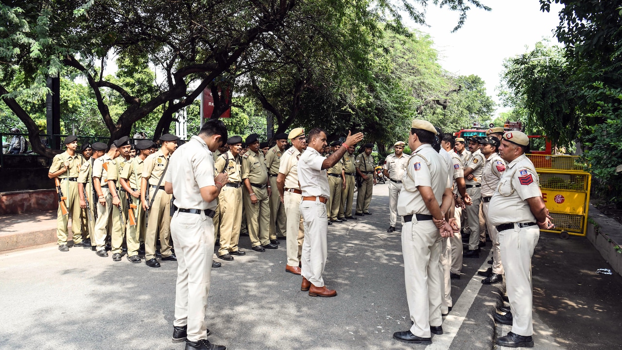 Delhi police personnel deploy outside Rajghat during a security mock drill to ensure foolproof security ahead of the BRICS Summit. Delhi police personnel deploy outside Rajghat during a security mock drill to ensure foolproof security ahead of the BRICS Summit.