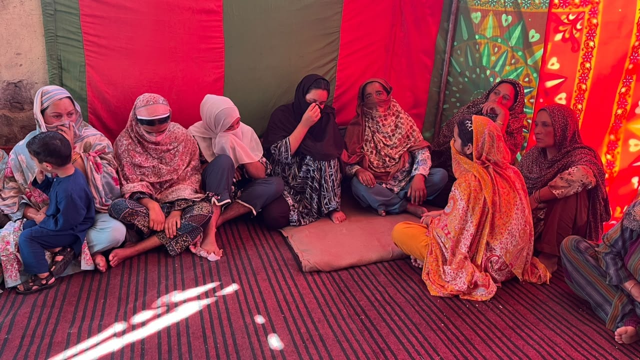 Relatives and villagers try to comfort Momins mother inside a tent erected along the riverside. Relatives and villagers try to comfort Momins mother inside a tent erected along the riverside.