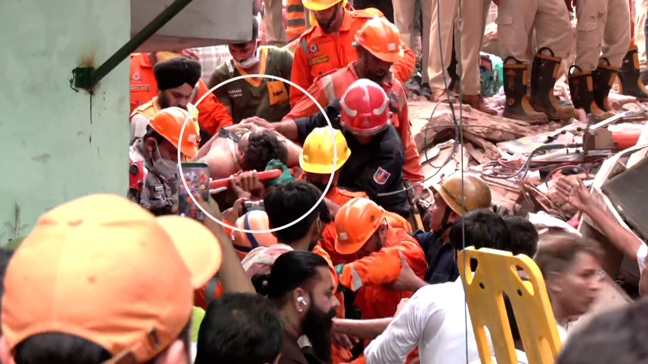 Rescue Teams Pull Survivor From Delhi Building Collapse Debris