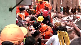 Rescue Teams Pull Survivor From Delhi Building Collapse Debris