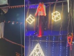 Effigies Of "Blue Drum" Murder Convicts Hung Alongside Demons At UP Pandal
