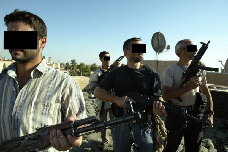 Iraqi and foreign mercenary members of a private security company, stand on the rooftop of a house in Baghdad, 18 September 2007. Iraq declared today it will review the operations of all security firms working in the war-ravaged country following a deadly shootout involving private US contractor Blackwater. Iraqi and foreign mercenary members of a private security company, stand on the rooftop of a house in Baghdad, 18 September 2007. Iraq declared today it will review the operations of all security firms working in the war-ravaged country following a deadly shootout involving private US contractor Blackwater.