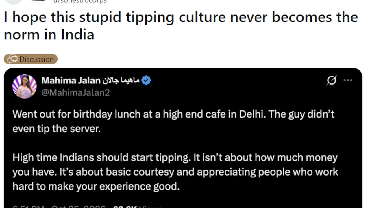Giving tips to a waiter in India