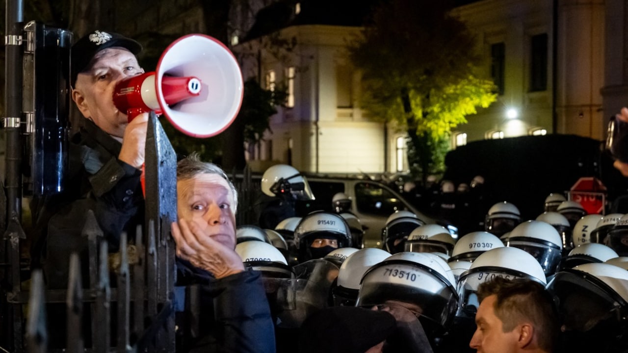 Constitutional court president Bogdan Swieczkowski speaks with a megaphone as protesters gather outside the headquarters of the Polands Constitutional Court in Warsaw after police blocked access to the court building on October 30, 2026. Constitutional court president Bogdan Swieczkowski speaks with a megaphone as protesters gather outside the headquarters of the Polands Constitutional Court in Warsaw after police blocked access to the court building on October 30, 2026.