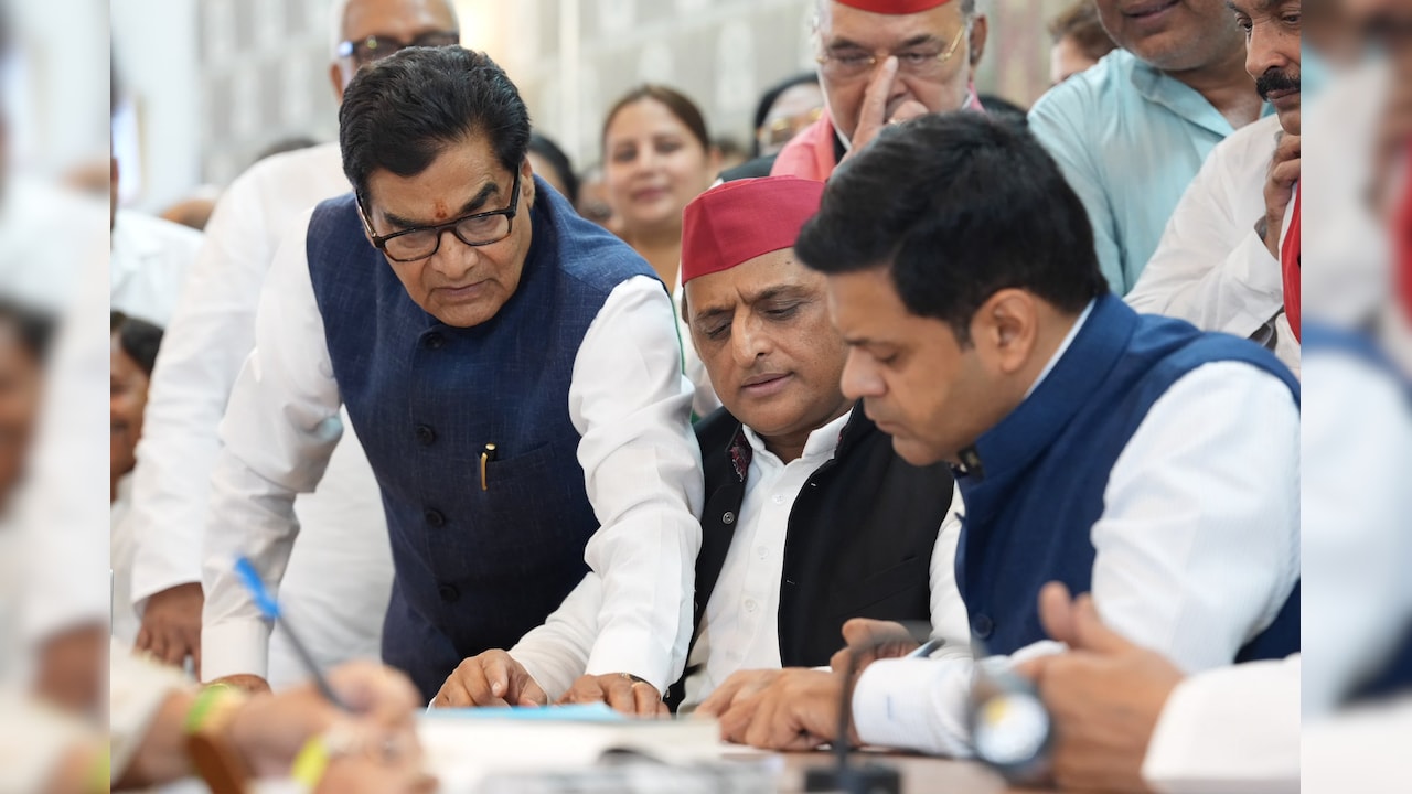 Akhilesh Yadav with SP candidates Ram Gopal Yadav and Dhanraj Parimal Nathwani