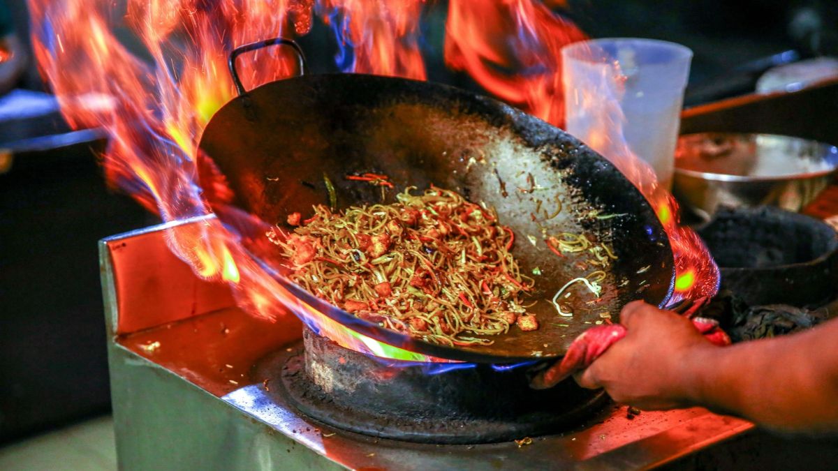 Why Chinese Food Often Bursts Into Flames During Cooking