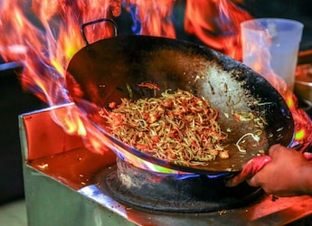 Why Does Chinese Food Catch Fire In The Wok? The Science Behind Those Dramatic Flames