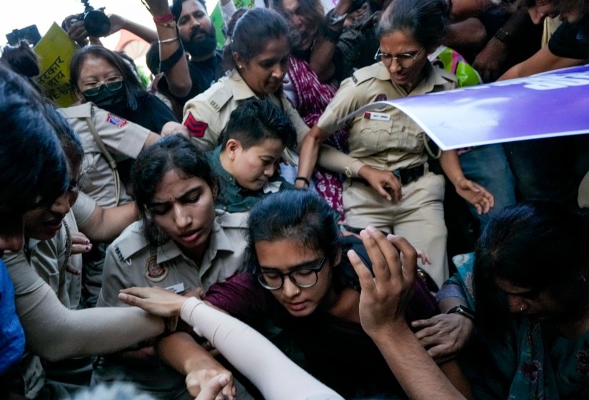 AISA chief Neha Bora being detained by the police during a protest against Chief Election Commissioner (CEC) Gyanesh Kumar AISA chief Neha Bora being detained by the police during a protest against Chief Election Commissioner (CEC) Gyanesh Kumar
