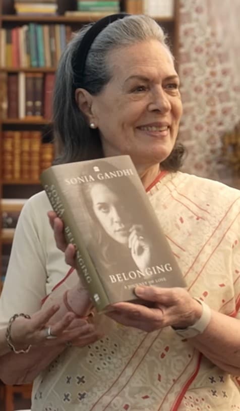 Sonia Gandhi with her copy of Belonging: A Journey Of Love