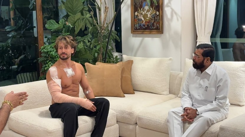 Eknath Shinde, right, during a meeting with Bollywood actor Tiger Shroff after unidentified assailants fired at the actors car on Sunday. Eknath Shinde, right, during a meeting with Bollywood actor Tiger Shroff after unidentified assailants fired at the actors car on Sunday.
