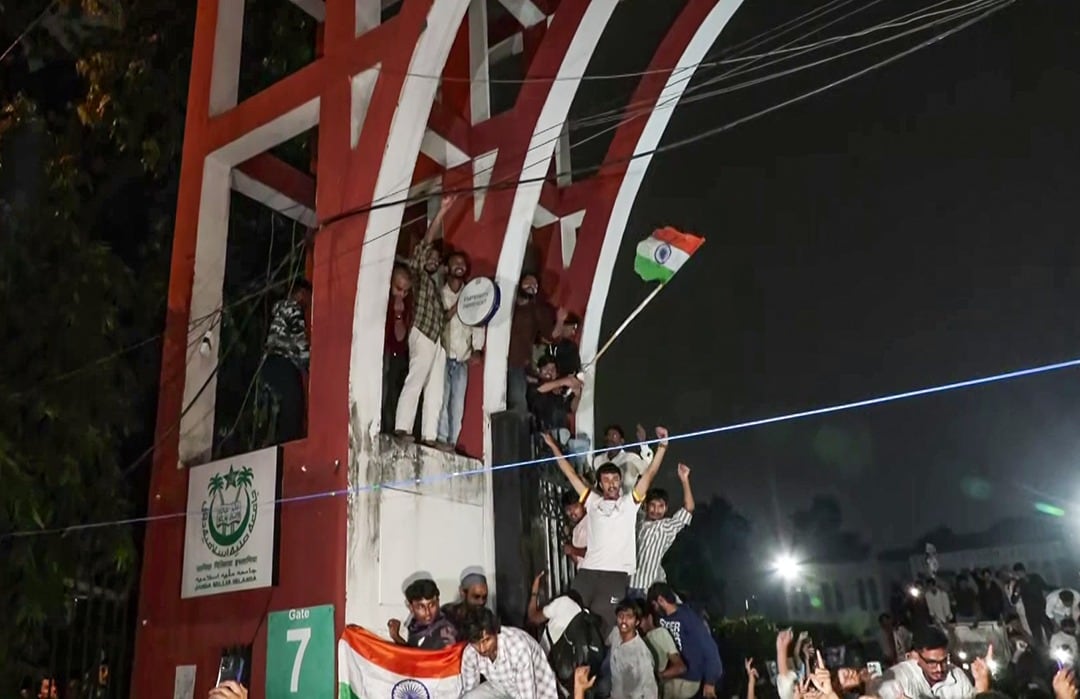 Students celebrating on the campus gate as the Jamia administration accepted their demands on October 29 evening.