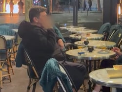 Couple Enjoys Drinks In Paris As Fires Rage Nearby Amid Protests In France