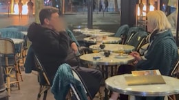 Couple Enjoys Drinks In Paris As Fires Rage Nearby Amid Protests In France
