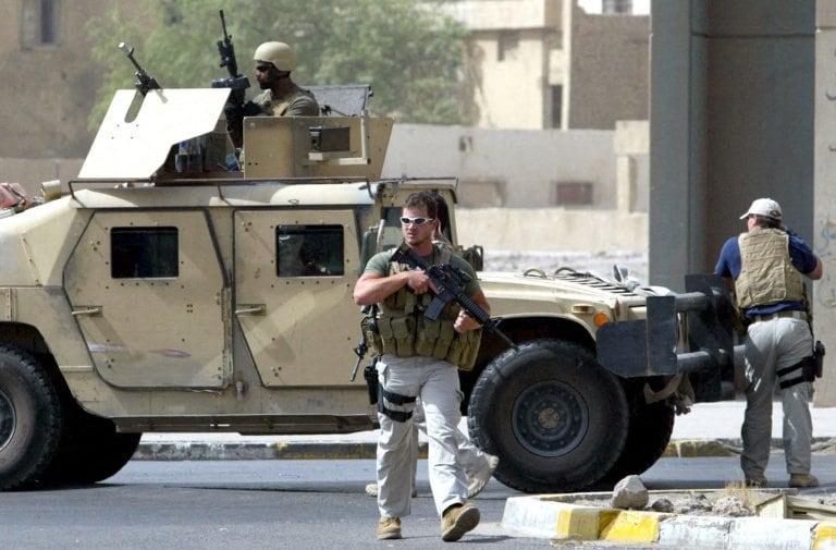A picture taken on July 5, 2005 shows contractors of the US private security firm Blackwater securing the site of a roadside bomb attack near the Iranian embassy in central Baghdad. Iraq has filed a lawsuit against private security firm Blackwater in a US court and will file another in Iraq, Prime Minister Nuri al-Maliki said on January 4, 2010, amid fury over an American court dropping charges against five Blackwater guards. A picture taken on July 5, 2005 shows contractors of the US private security firm Blackwater securing the site of a roadside bomb attack near the Iranian embassy in central Baghdad. Iraq has filed a lawsuit against private security firm Blackwater in a US court and will file another in Iraq, Prime Minister Nuri al-Maliki said on January 4, 2010, amid fury over an American court dropping charges against five Blackwater guards.