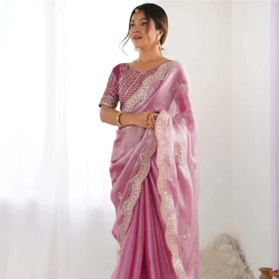 Click here to buy: KRADDLE Embellished Bollywood Organza Saree with Unstitched Blouse