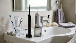 Electric Toothbrushes And Water Flossers: Are They Worth The Upgrade? A Dentist Breaks It Down