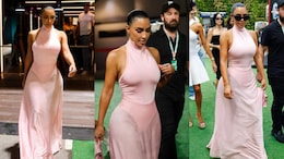 Kim Kardashian Cheers On Lewis Hamilton In A Baby Pink Leotard And Matching Sheer Skirt