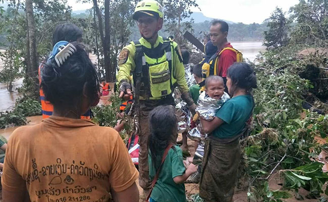 Baby Saved From Laos Dam Disaster By Thai Cave Rescue Volunteers