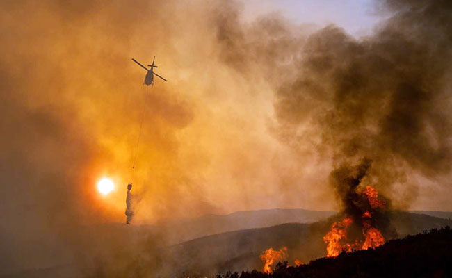 Fires Engulf California Tourist Spots Ahead Of Holiday Weekend