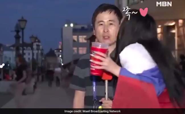 Russian Football Fans Kiss Reporter On Live TV, Gender Debate Follows