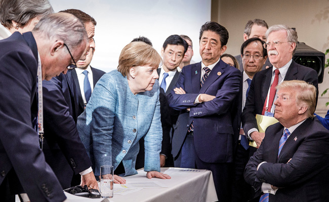 ICYMI: This Pic Of Merkel, Trump From G7 Summit Launched A Thousand Memes