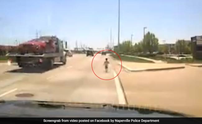 Watch: Police Officer Rescues Toddler Who Ran Into Traffic On Busy Highway