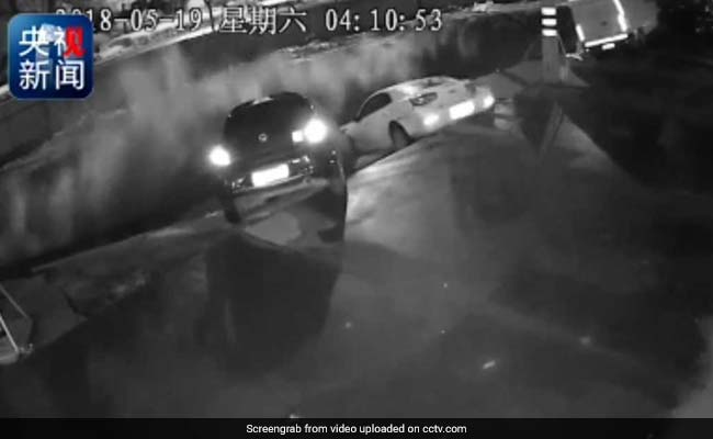 10-Foot Sinkhole Swallows Three Cars. Watch The Moment It Opens Up