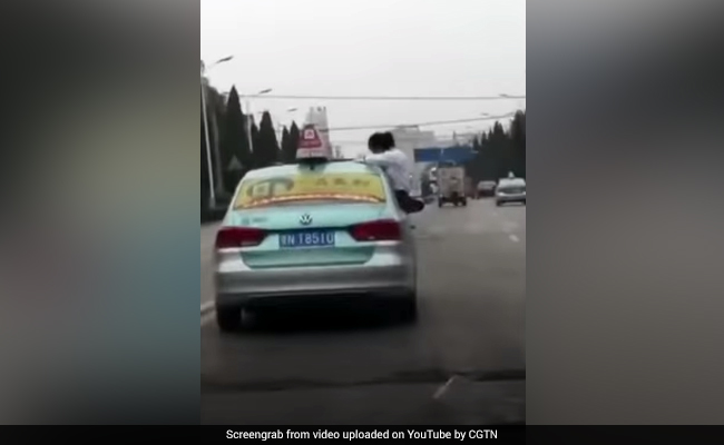 Student Filmed Doing Homework On Roof Of Moving Taxi. Dad Was Driving