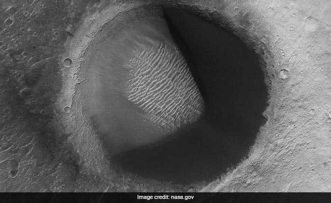 NASA Spots Pac-Man Shaped Crater On Mars
