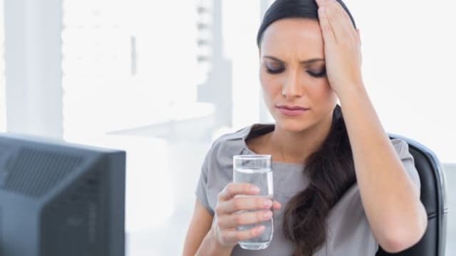 Dehydration can cause the brain to temporarily contract from fluid loss, leading to pain