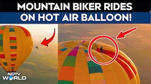 Hot Balloon Ride | Cyclist Becomes First to Ride On Top of Hot Air Balloon Before Jumping Off
