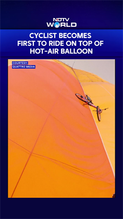 Mountain Biker Rides On Hot Air Balloon!