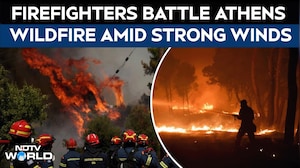 Firefighters Battle Wildfire West of Athens as Strong Winds Fuel Flames