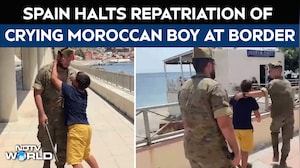 Spain Soldiers Escort Crying Moroccan Boy To Border Before Repatriation Halted