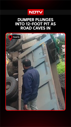 Dumper Plunges Into 12-Foot Pit As Road Caves In