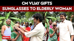 CM Vijay Gifts Sunglasses To Elderly Woman In Mettur