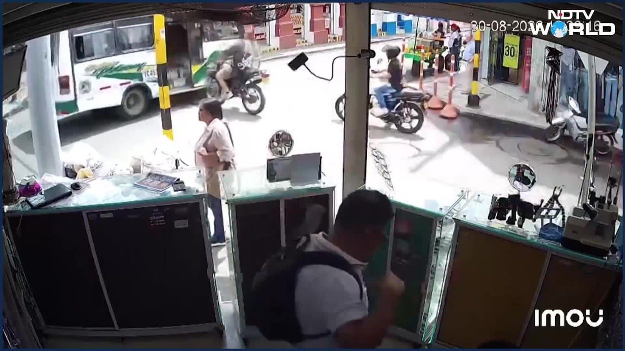 Speeding Biker Flies Through Moving Bus Door In Colombia